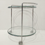 Glass side table on wheels