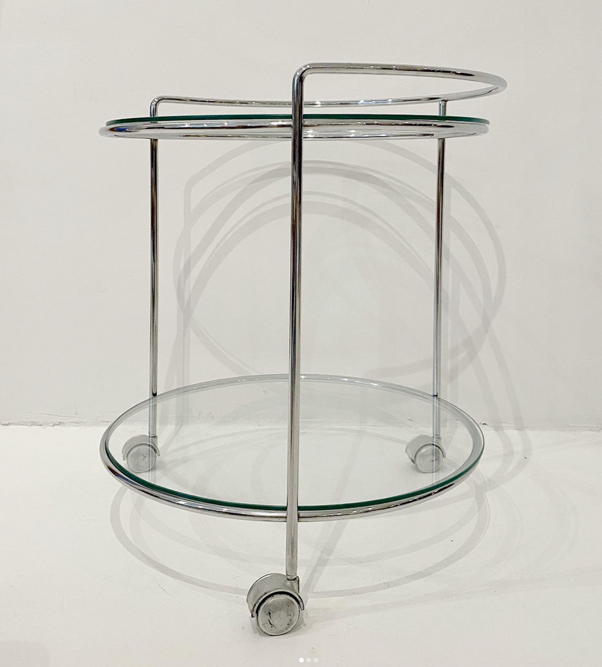 Glass side table on wheels