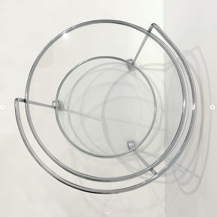 Glass side table on wheels