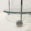 Glass side table on wheels