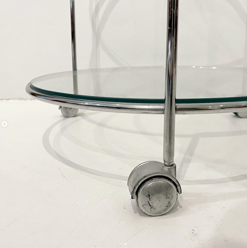 Glass side table on wheels